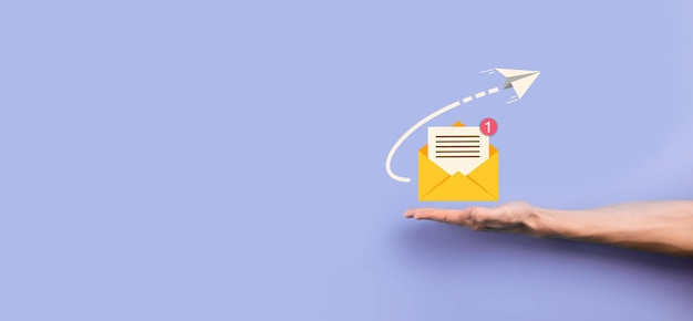 Businessman hand holding letter iconemail iconsContact us by newsletter email and protect your personal information from spam mailCustomer service call center contact usEmail marketing newsletter