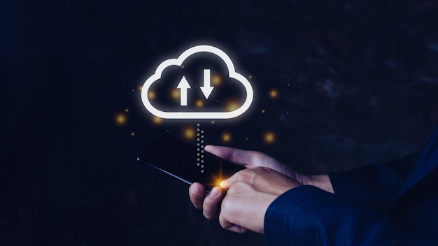 Businessman holding smartphone with virtual cloud computing to transfer database information upload download application technology business transformation concept
