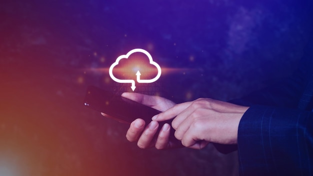 businessman holding smartphone with virtual cloud computing to transfer database information upload download application technology business transformation concept