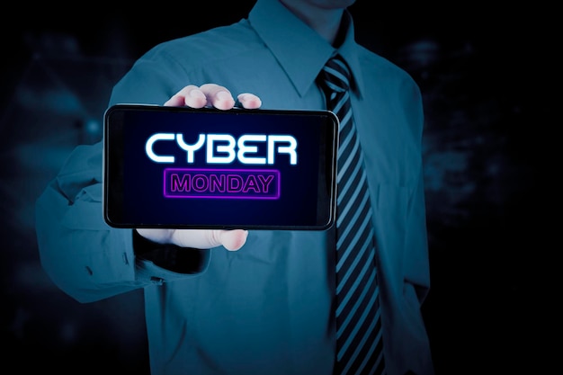 Businessman showing cyber monday text on cellphone