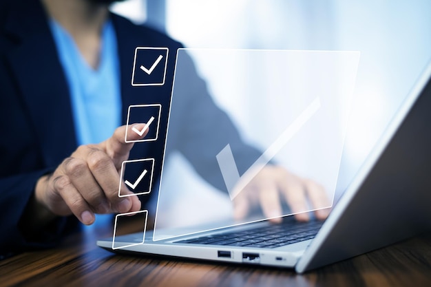 Businessman touch on digital screen check correct sign mark in checkbox for quality document control checklist for business approve