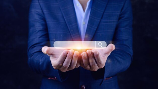 Businessman touching data search box information technology Search Engine Optimization uses a search box to search for information on the Internet
