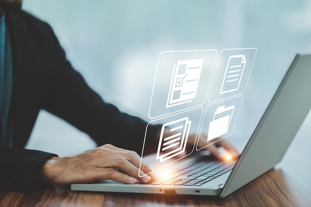Businessman using computer Document Management System DMS online documentation database process automation to efficiently manage files