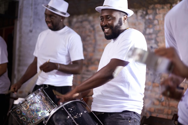Carnival drummer and music with band in Brazil for entertainment festival or performance event Smile concert and black man playing drums in Rio de Janeiro for culture heritage or tradition