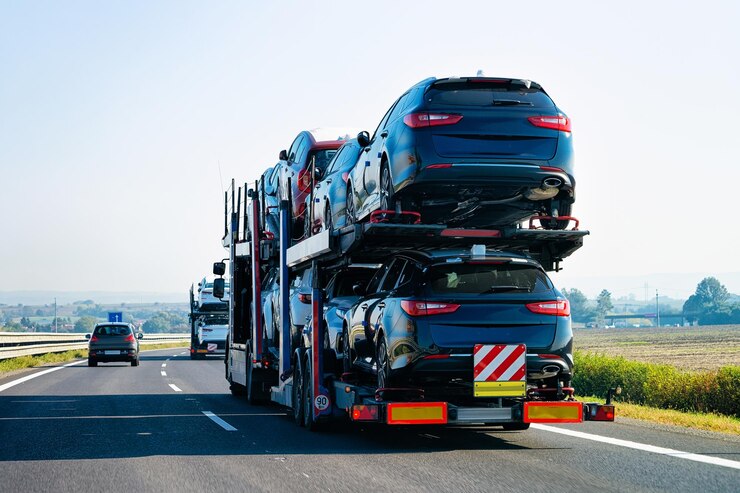 Foto cars carrier truck on the asphalt road, poland. truck transporter