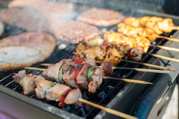 Chickens cooking on barbecue grill