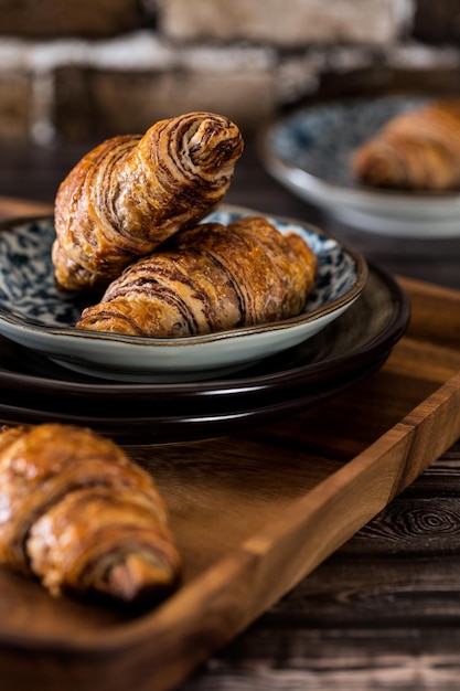 close-up of chocolate croissant in plate on table