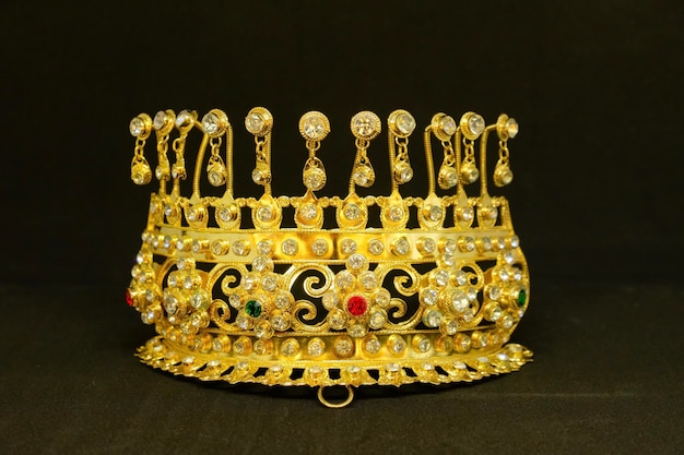 Close-up of crown against black background