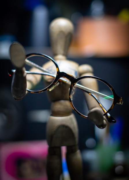 close-up of eyeglasses on figurine