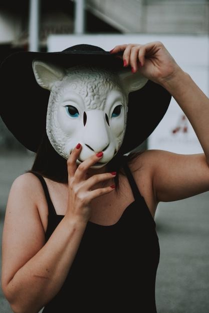 Close-up of person holding mask