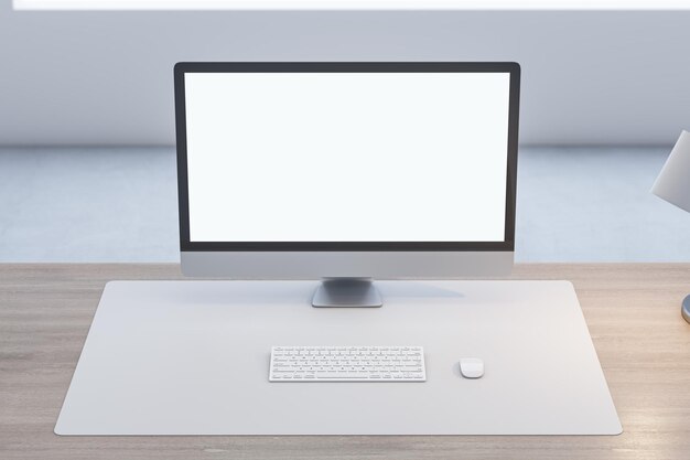 Close up of wooden office desk with empty white computer monitor and mock up place for your advertisement lamp and keyboard on blurry background 3D Rendering