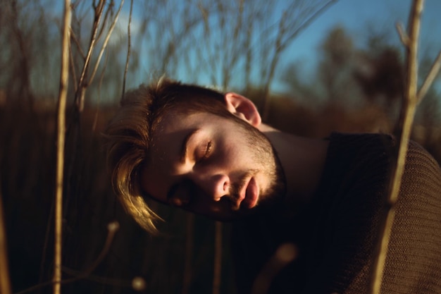 Close-up of young man in trees