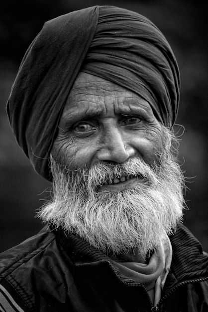 Close-up portrait of bearded man wearing turban