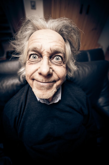 Close-up portrait of smiling senior man