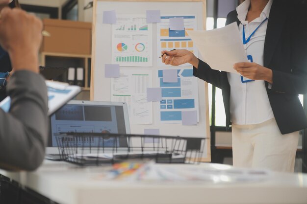 Close up ux developer and ui designer use augmented reality brainstorming about mobile app interface wireframe design on desk at modern officeCreative digital development agency
