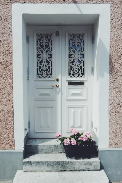 Closed white door of house