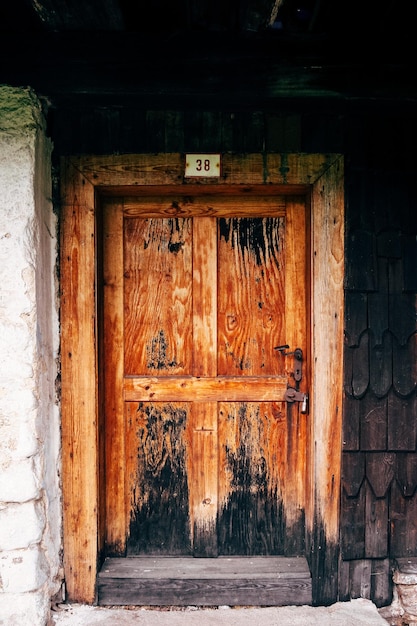 Closed wooden door of old building