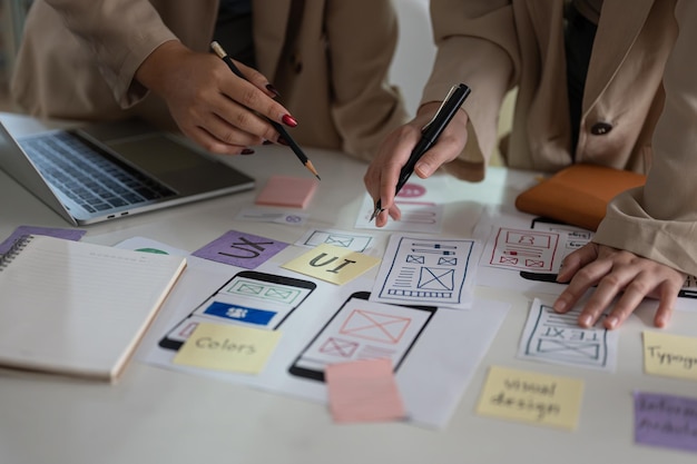 closeup hand image of a creative ux ui graphic designer team is in the meeting
