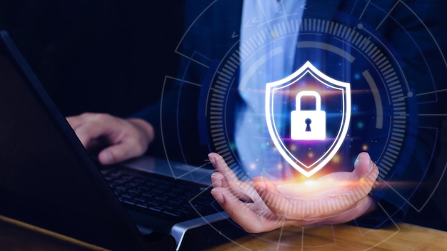 Computer network protection secure and safe your data concept businessman holding shield protection icon Security shield Lock Security Businessman Protect Concept