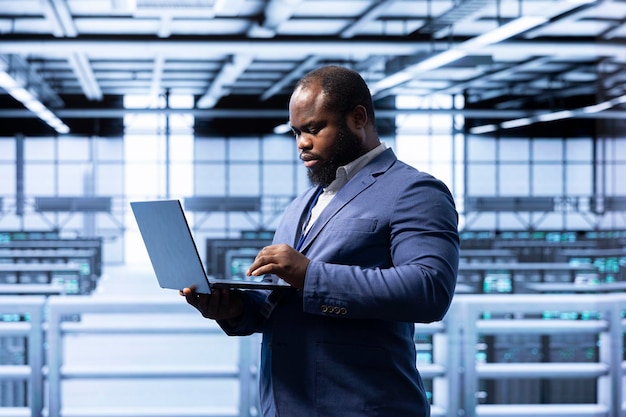 Computer scientist in data center making sure rackmounts are functioning