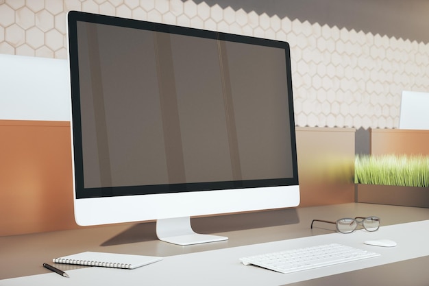 Contemporary office workplace and computer with blank screen