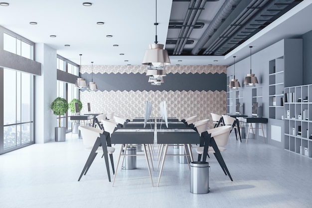 Coworking office interior with furniture and computers on table