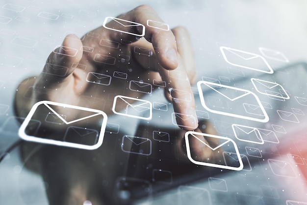 Creative concept of postal envelopes illustration with finger clicks on a digital tablet on background Email and communications concept Multiexposure