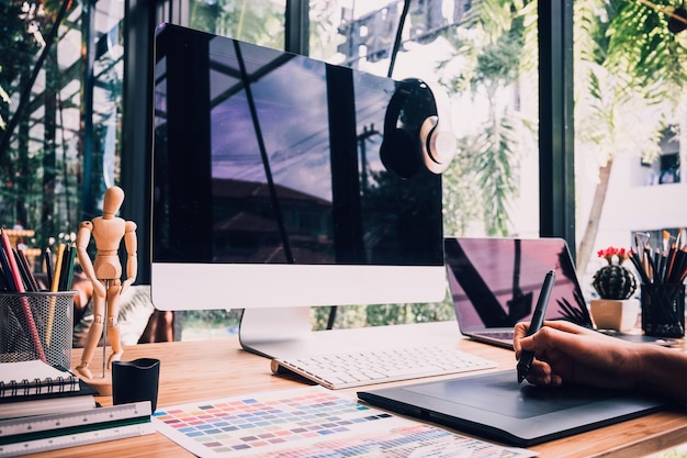 Cropped image of woman using computer at office