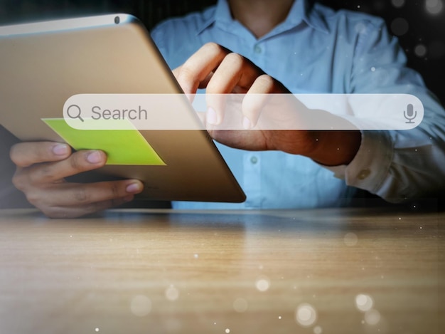 data search technology search engine optimization mans hands are using a tablet