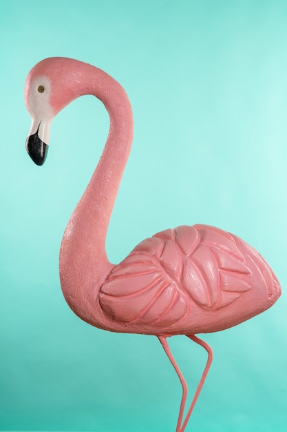 Decorative figure of pink flamingo on blue.