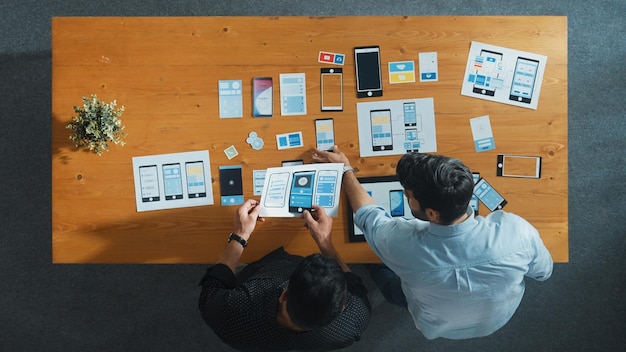 Developer working on Ux ui design while partner working together Convocation