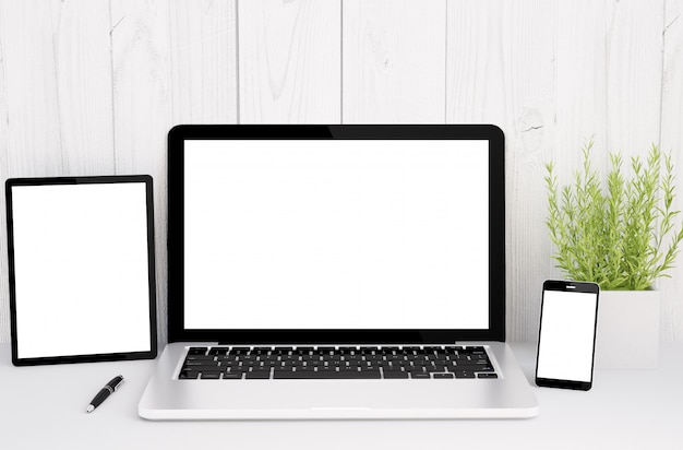 devices on table with blank screen