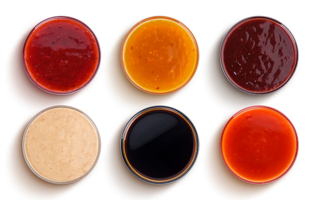 Different sauces isolated on white background, top view