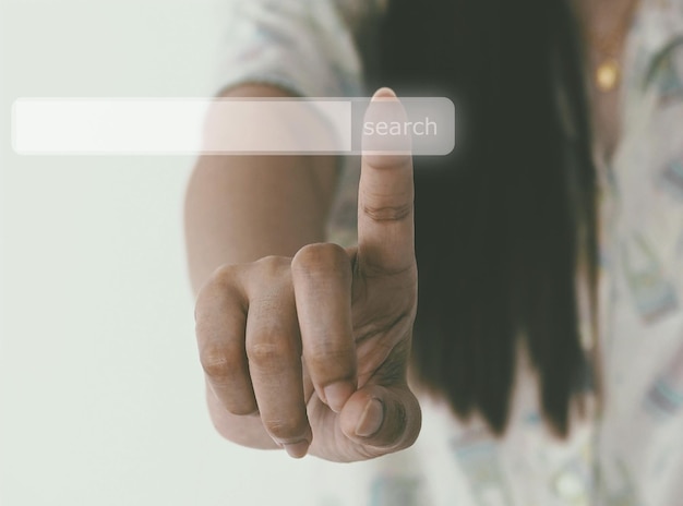 digital composite image of woman touching text on invisible screen