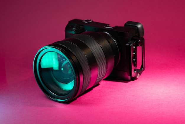 Digital photo mirrorless camera on clean pastel background