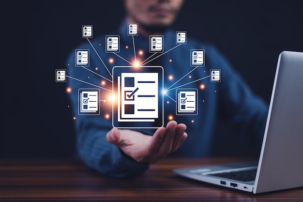 Documents manage program DMSDocument management system concept business man holding document icon software searching and managing files online document database documents manage program DMS