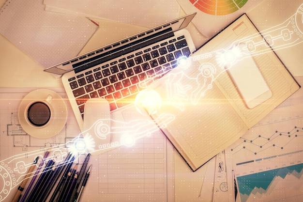 Double exposure of data drawing hologram over topview of study desk background with computer Concept of Ai