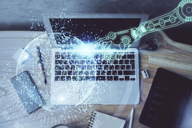 Double exposure of desktop computer and technology theme hologram Concept of software development