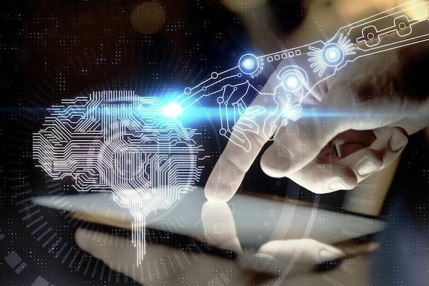 double exposure of mans hand holding and using a digital device and brain hologram drawing data concept
