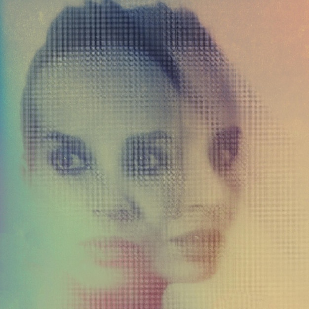 Double exposure of thoughtful woman and textile