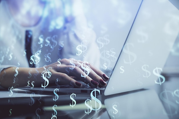 Double exposure of woman hands typing on computer and financial graph hologram drawing Stock market analysis concept