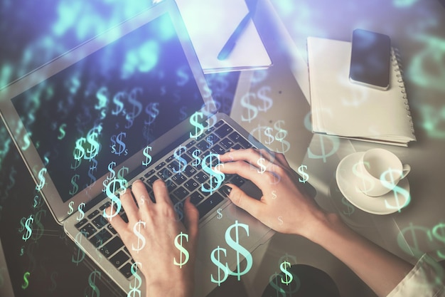 Double exposure of woman hands typing on computer and forex chart hologram drawing Stock market invest concept