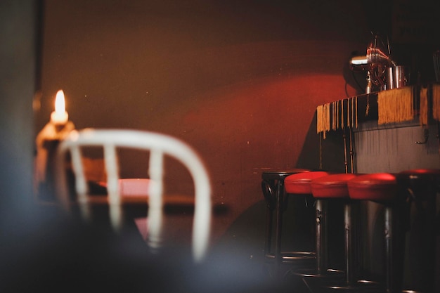 Empty stools by bar counter