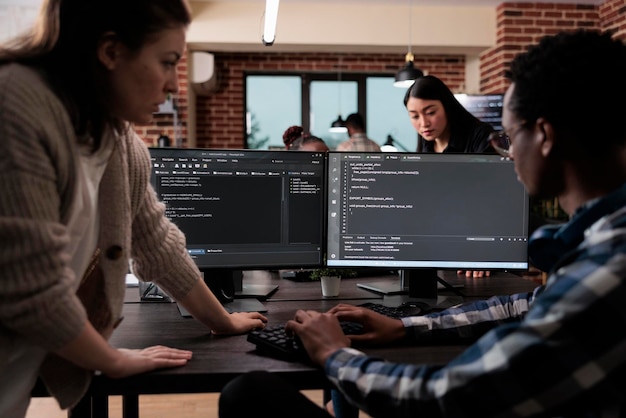 Expert programmers developing data decryption high tech software in order to save corrupted files. Cyber security agency employees creating blockchain encryption technology for more secured platform.