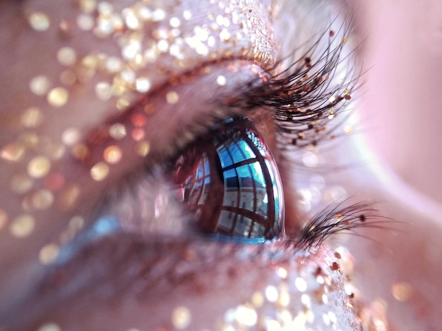 extreme close-up of woman eye with glitter