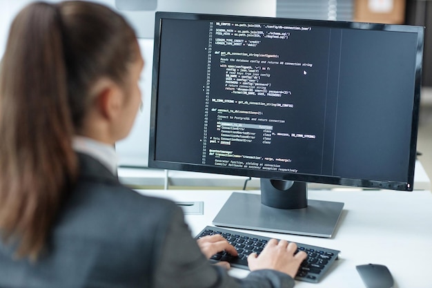 Female programmer using computer