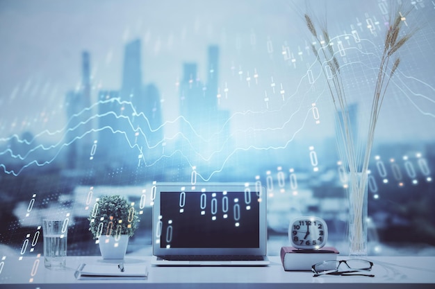 forex graph hologram on table with computer background multi exposure concept of financial markets