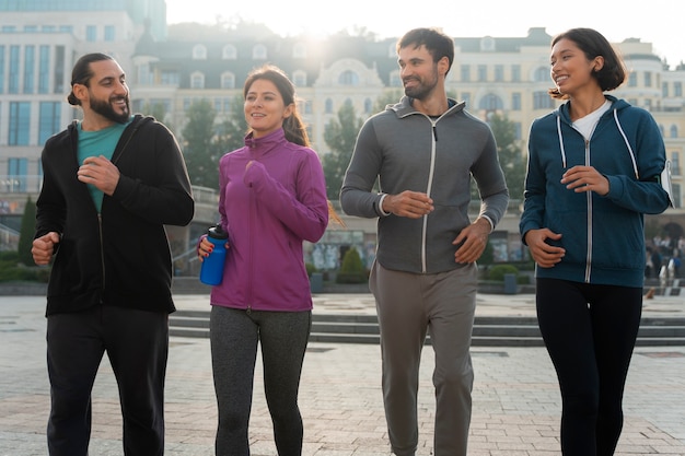 Front view latin people training outdoors