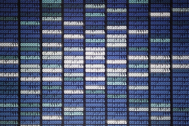Full frame shot of computer monitor screen displaying binary code information bit language