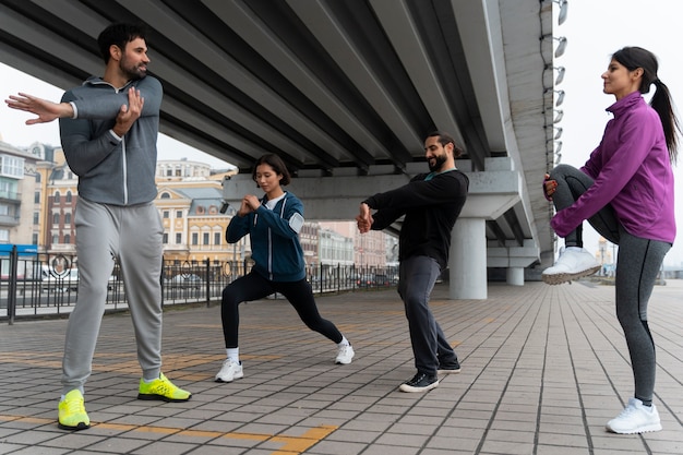 Full shot latin people training outdoors
